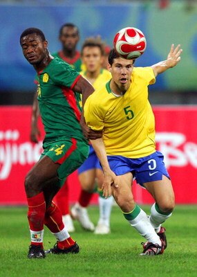 SHENYANG, CHINA - AUGUST 16:  Hernanes of Brazil and Aurelien Chedjou of Cameroon compete for the ball during the Men's Quarter Final match between Brazil and Cameroon at Shenyang Olympic Stadium on Day 8 of the Beijing 2008 Olympic Games on August 16, 20