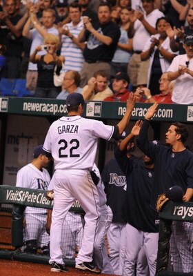 ST. PETERSBURG, FL - APRIL 30: Pitcher  Matt Garza  #22 of  the Tampa Bay Rays celebrates with teamates after throwing a one-hitter against the Boston Red Sox April 30, 2009 at Tropicana Field in St. Petersburg, Florida.  (Photo by Al Messerschmidt/Getty 