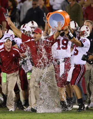 LOS ANGELES - OCTOBER 6:  Alex Loukas #15 celebrates with head coach Jim Harbaugh of the Stanford University Cardinal after defeating the USC Trojans 24-23 at the Los Angeles Memorial Coliseum October 6, 2007 in Los Angeles, California.  (Photo by Lisa Bl