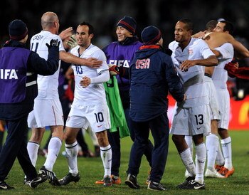 BLOEMFONTEIN, SOUTH AFRICA - JUNE 24:   Ricardo Clark (#13) and Landon Donovan (#10) of USA celebrate victory with teammates and substitutes at the end of the FIFA Confederations Cup Semi Final match against Spain at Free State Stadium on June 24, 2009 in