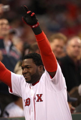 BOSTON - JUNE 11:  David Ortiz #34 of the Boston Red Sox hits a home run and celebrates against the New York Yankees at Fenway Park on June 11, 2009 in Boston, Massachusetts.  (Photo by Jim Rogash/Getty Images)