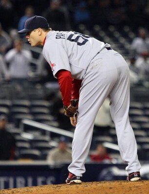 NEW YORK - MAY 04:  Jonathan Papelbon #58 of the Boston Red Sox deals a pitch against the New York Yankees on May 4, 2009 at Yankee Stadium in the Bronx borough of New York City. The Red Sox defeated the Yankees 6-4.  (Photo by Jim McIsaac/Getty Images)