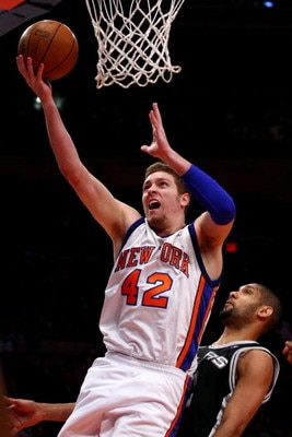 NEW YORK - FEBRUARY 17: David Lee #42 of the New York Knicks drives to the basket on Tim Duncan #21 of the San Antonio Spurs at Madison Square Garden February 17, 2009 in New York City. NOTE TO USER: User expressly acknowledges and agrees that, by downloa