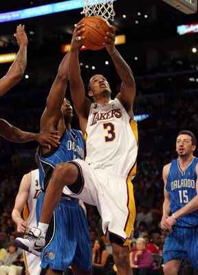 LOS ANGELES, CA - JUNE 07:  Trevor Ariza #3 of the Los Angeles Lakers goes up for a shot against Dwight Howard #12 of the Orlando Magic in the second half of Game Two of the 2009 NBA Finals at Staples Center on June 7, 2009 in Los Angeles, California. NOT