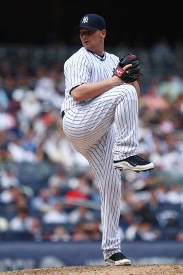 NEW YORK - JUNE 04:  Phil Coke #48 of the New York Yankees pitches against the Texas Rangers during their game on June 4, 2009 at Yankee Stadium in the Bronx borough of New York City.  (Photo by Chris McGrath/Getty Images)