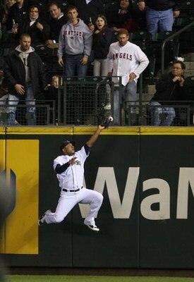 SEATTLE - SEPTEMBER 25: Right fielder Wladimir Balentien #50 of the Seattle Mariners just misses a home run ball by Vladimir Guerrero of the Los Angeles Angels of Anaheim on September 25, 2008 at Safeco Field in Seattle, Washington. (Photo by Otto Greule 
