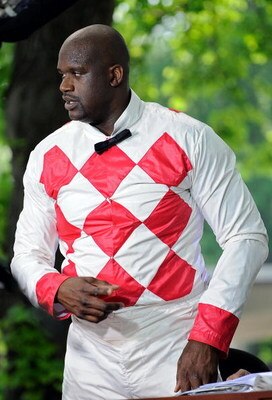 ELMONT, NY - JUNE 07:  Shaquille O'Neal #32 of the Phoenix Suns finishes a TV interview while dressed as a jockey prior to the start of the 140th running of the Belmont Stakes at Belmont Park on June 7, 2008 in Elmont, New York.  (Photo by Jeff Zelevansky