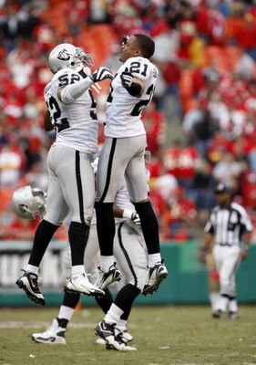 KANSAS CITY, MO - SEPTEMBER 14:  Kirk Morrison #52 and Nnamdi Asomugha #21 of the Oakland Raiders celebrate on the field during their NFL game against the Kansas City Chiefs at Arrowhead Stadium on September 14, 2008 in Kansas City, Missouri. The Raiders 
