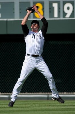 DENVER - MAY 07:  Rightfielder Brad Hawpe #11 of the Colorado Rockies fields a fly ball against the San Francisco Giants during MLB action at Coors Field on May 7, 2009 in Denver, Colorado. The Giants defeated the Rockies 8-3.  (Photo by Doug Pensinger/Ge