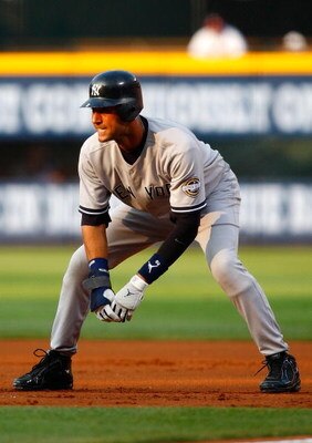 ATLANTA - JUNE 25:  Derek Jeter #2 of the New York Yankees steps off of first base against the Atlanta Braves at Turner Field on June 25, 2009 in Atlanta, Georgia.  (Photo by Kevin C. Cox/Getty Images)