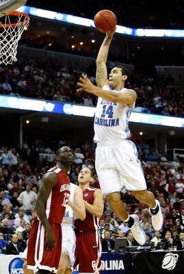 MEMPHIS, TN - MARCH 29:  Danny Green #14 of the North Carolina Tar Heels goes up to dunk the ball as Willie Warren #12 of the Oklahoma Sooners looks up in the second half during the NCAA Men's Basketball Tournament South Regional Final at the FedExForum o