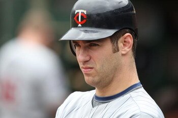 OAKLAND, CA - JUNE 11:  Joe Mauer #7 of the Minnesota Twins looks on against the Oakland Athletics during a Major League Baseball game on June 11, 2009 at the Oakland Coliseum in Oakland, California.  (Photo by Jed Jacobsohn/Getty Images)