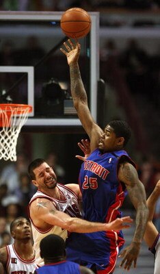 CHICAGO - MARCH 24: Brad Miller #52 of the Chicago Bulls fouls Amir Johnson #25 of the Detroit Pistons at the United Center March 24, 2009 in Chicago, Illinois. The Bulls defeated the Pistons 99-91. NOTE TO USER: User expressly acknowledges and agrees tha