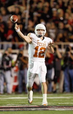 LUBBOCK,TEXAS - NOVEMBER 1:  Quarterback Colt McCoy #12 of the Texas Longhorns passes the ball during the game against the Texas Tech Red Raiders on November 1, 2008 at Jones Stadium in Lubbock, Texas. (Photo by: Jamie Squire/Getty Images)
