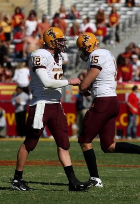 LOS ANGELES, CA - OCTOBER 11: Quarterback Rudy Carpenter #12 of the Arizona State Sun Devils walks off the field after being shaken up as his replacement Danny Sullivan #15 runs on in the game against the USC Trojans on October 11, 2008 at the Los Angeles