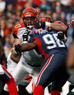 ORCHARD PARK, NY - NOVEMBER 04: Andrew Whitworth #77 of the Cincinnati Bengals blocks Larry Tripplett #98 of the Buffalo Bills  on November 4, 2007 at Ralph Wilson Stadium in Orchard Park, New York. (Photo by Rick Stewart/Getty Images)