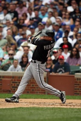 CHICAGO - JUNE 18:  A.J. Pierzynski #12 of the Chicago White Sox bats against the Chicago Cubs during the game on June 18, 2009 at Wrigley Field in Chicago, Illinois. (Photo by Jonathan Daniel/Getty Images)