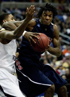 WASHINGTON - MARCH 20:  Jordan Hill #45 of the Arizona Wildcats goes to the hoop against Wellington Smith #35 of the West Virginia Mountaineers during the first round of the West Regional as part of the 2008 NCAA Men's Basketball Tournament at the Verizon