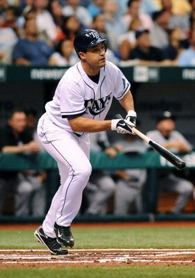 ST. PETERSBURG, FL - APRIL 15: Designed hitter Pat Burrell #5 of the Tampa Bay Rays bats against the New York Yankees at Tropicana Field on April 15, 2009 in St. Petersburg, Florida. All Major League Baseball players are wearing #42 in honor of Jackie Rob