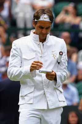 WIMBLEDON, ENGLAND - JUNE 26:  Roger Federer of Switzerland prepares prior to the men's singles third round match against Philipp Kohlschreiber of Germany on Day Five of the Wimbledon Lawn Tennis Championships at the All England Lawn Tennis and Croquet Cl