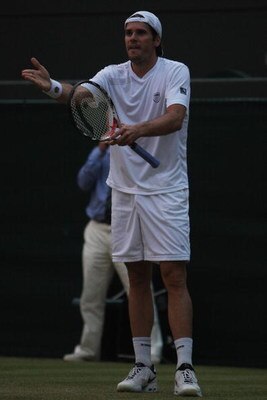 WIMBLEDON, ENGLAND - JUNE 26:  Tommy Haas of Germany questions the light levels on court during the men's singles third round match against Marin Cilic of Croatia on Day Five of the Wimbledon Lawn Tennis Championships at the All England Lawn Tennis and Cr