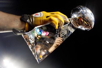 TAMPA, FL - FEBRUARY 01:  Players from the Pittsburgh Steelers celebrate with the Vince Lombardi trophy after their 27-23 win against the Arizona Cardinals during Super Bowl XLIII on February 1, 2009 at Raymond James Stadium in Tampa, Florida.  (Photo by 