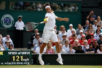 WIMBLEDON, ENGLAND - JUNE 26:  Roger Federer of Switzerland plays a forehand during the men's singles third round match against Philipp Kohlschreiber of Germany on Day Five of the Wimbledon Lawn Tennis Championships at the All England Lawn Tennis and Croq