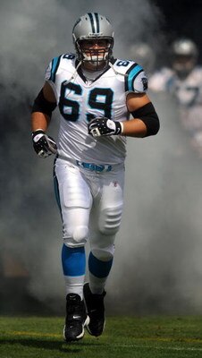 CHARLOTTE, NC - SEPTEMBER 28:  Offensive left tackle Jordan Gross #69 of the Carolina Panthers runs out of the tunnel during introductions before the game against the Atlanta Falcons at Bank of America Stadium on September 28, 2008 in Charlotte, North Car