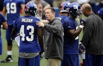EAST RUTHERFORD, NJ - MAY 09:  Defensive coordinator Bill Sheridan and Kenny Ingram #43 of the New York Giants work drills at rookie camp on May 9, 2009 in East Rutherford, New Jersey.  (Photo by Jeff Zelevansky/Getty Images)