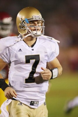 LOS ANGELES - NOVEMBER 29:  Jimmy Clausen #7 of the Notre Dame Fighting Irish walks on the field against the USC Trojans on November 29, 2008 at the Los Angeles Memorial Coliseum in Los Angeles, California.  USC won 38-3.  (Photo by Jeff Golden/Getty Imag
