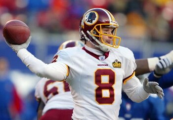 EAST RUTHERFORD, NJ - DECEMBER 7:  Quarterback Tim Hasselback #8 of the Washington Redskins throws against the New York Giants during their game on December 7, 2003 at Giants Stadium in East Rutherford, New Jersey.  (Photo by Al Bello/Getty Images)