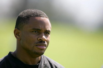 ALAMEDA, CA - MAY 08: Nnamdi Asomugha #21 of the Oakland Raiders watches practice from the sideline during the Raiders minicamp at the team's permanent training facility on May 8, 2009 in Alameda, California. (Photo by Ezra Shaw/Getty Images)