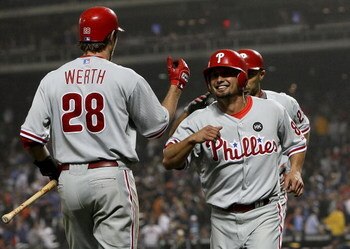 NEW YORK - JUNE 11: Shane Victorino #8 of the Philadelphia Phillies celebrates scoring on a Raul Ibanez home run with teammate Jayson Werth #28 against the New York Mets on June 11, 2009 at Citi Field in the Flushing neighborhood of the Queens borough of 