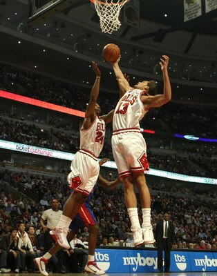 CHICAGO - MARCH 24: Joakim Noah #13 and Tyrus Thomas #24 of the Chicago Bulls reach for a rebound against the Detroit Pistons on March 24, 2009 at the United Center in Chicago, Illinois. The Bulls defeated the Pistons 99-91. NOTE TO USER: User expressly a