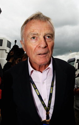 NORTHAMPTON, UNITED KINGDOM - JUNE 21: F.I.A. President Max Mosley is surrounded by the media as he arrives in the paddock before the British Formula One Grand Prix at Silverstone on June 21, 2009 in Northampton, England. (Photo by Paul Gilham/Getty Ima