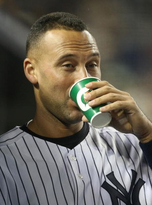 NEW YORK - JUNE 03: Derek Jeter #2 of the New York Yankees in the dugout against the Texas Rangers on June 3, 2009 at Yankee Stadium in the Bronx borough of New York City. (Photo by Nick Laham/Getty Images)