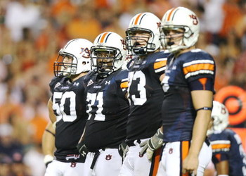 AUBURN, AL - SEPTEMBER 20: Offensive lineman Ryan Pugh #50, Tyronne Green #71, Lee Ziemba #73 and tight end Tommy Trott #5 of the Auburn Tigers prepare for a play while taking on the LSU Tigers at Jordan-Hare Stadium on September 20, 2008 in Auburn, Alab