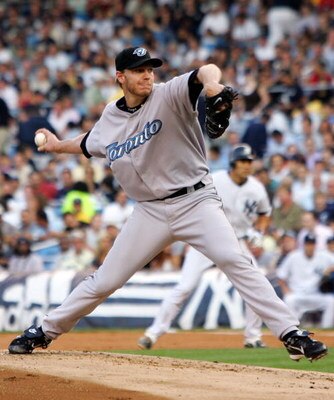 NEW YORK - JULY 17:  Roy Halladay #32 of the Toronto Blue Jays delivers a pitch against the New York Yankees during their game at Yankee Stadium on July 17, 2007 in the Bronx borough of New York City.  (Photo by Jim McIsaac/Getty Images)