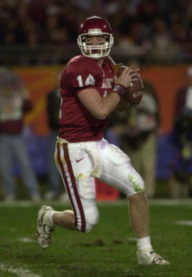 3 Jan 2001:  Quarterback Josh Heupel #14 of the Oklahoma Sooners rolls out of the pocket while playing the Florida State Seminoles during the Orange Bowl at Pro Player Stadium in Miami, Florida. DIGITAL IMAGE Mandatory Credit: Doug Pensinger/ALLSPORT