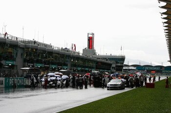 KUALA LUMPUR, MALAYSIA - APRIL 05:  Cars line up on the start finish straight as the race is red flagged due to rain during the Malaysian Formula One Grand Prix at the Sepang Circuit on April 5, 2009 in Kuala Lumpur, Malaysia.  (Photo by Paul Gilham/Getty