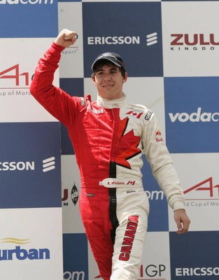 DURBAN, SOUTH AFRICA - FEBRUARY 24:  Canada's Robert Wickens celebrates on the podium after winning the A1GP Sprint Race on February 24, 2008 in Durban, South Africa.  (Photo by Tertius Pickard/Gallo Images/Getty Images)
