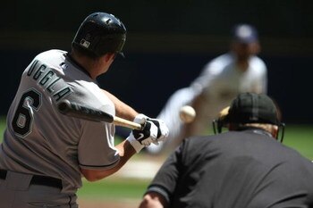 MILWAUKEE - MAY 14: Dan Uggla #6 of the Florida Marlins prepares to hit a pitch thrown by Dave Bush #31 of the Milwaukee Brewers on May 14, 2009 at Miller Park in Milwaukee, Wisconsin. The Brewers defeated the Marlins 5-3. (Photo by Jonathan Daniel/Getty 
