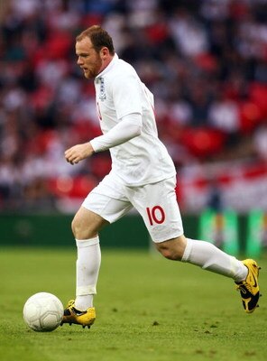 LONDON, ENGLAND - JUNE 10:  Wayne Rooney of England runs with the ball during the FIFA 2010 World Cup Group 6 Qualifying match between England and Andorra at Wembley Stadium on June 10, 2009 in London, England.  (Photo by Phil Cole/Getty Images)
