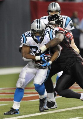 ATLANTA - NOVEMBER 23: Running back DeAngelo Williams #34 of the Carolina Panthers rushes upfield against the Atlanta Falcons at the Georgia Dome on November 23, 2008 in Atlanta, Georgia.  (Photo by Al Messerschmidt/Getty Images) 