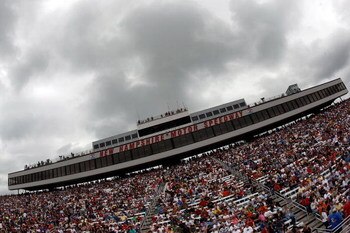 LOUDON, NH - JUNE 28:  Fans wait for the start of the NASCAR Sprint Cup Series LENOX Industrial Tools 301 under heavy rain clouds at New Hampshire Motor Speedway on June 28, 2009 in Loudon, New Hampshire.  (Photo by Chris Graythen/Getty Images)