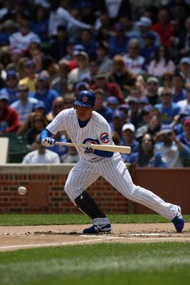 CHICAGO - MAY 2:  Kosuke Fukudome #1 of the Chicago Cubs bunts against the Florida Marlins during the game on May 2, 2009 at Wrigley Field in Chicago, Illinois. (Photo by Jonathan Daniel/Getty Images) 
