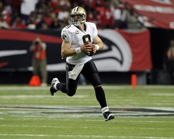 ATLANTA - NOVEMBER 9: Quarterback Drew Brees #9 of the New Orleans Saints sets to pass against the Atlanta Falcons at the Georgia Dome on November 9, 2008 in Atlanta, Georgia.  (Photo by Al Messerschmidt/Getty Images) 