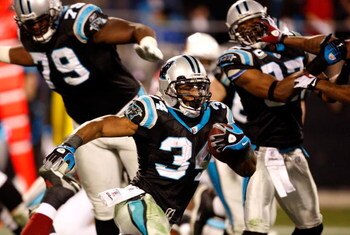CHARLOTTE, NC - JANUARY 10:  DeAngelo Williams #34 of the Carolina Panthers runs with the ball against  the Arizona Cardinals during the NFC Divisional Playoff Game on January 10, 2009 at Bank of America Stadium in Charlotte, North Carolina. The Arizona C