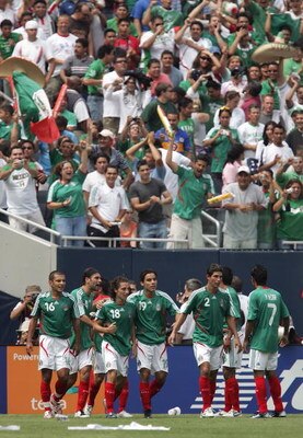 CHICAGO - JUNE 24:  Team Mexico celebrates around Jose Andres Guardado #18 (3rd L) after Guardado scored a goal to give Mexico a 1-0 lead against the USA during the CONCACAF Gold Cup Final match at Soldier Field on June 24, 2007 in Chicago, Illinois.  (Ph