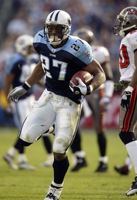 NASHVILLE, TN - DECEMBER 28:  Running back Eddie George #27 of the Tennessee Titans runs the football during the game against the Tampa Bay Buccaneers on December 28, 2003 at The Coliseum in Nashville, Tennessee. The Titans defeated the Buccaneers 33-13. 